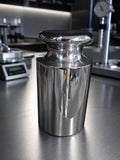 Representative polished cylindrical calibration weight in an INSCO laboratory; see product specifications for nominal mass.